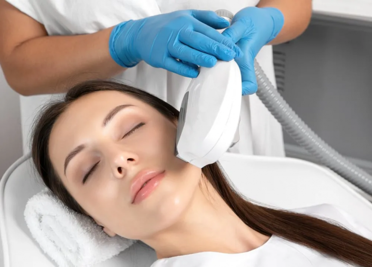 Esthetician performing facial treatment on client